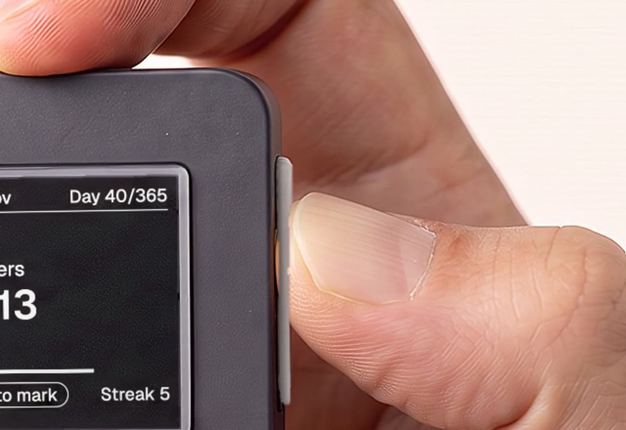 A thumb presses the bar on PressOn's side while the screen shows Hold to mark